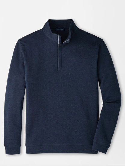 The Peter Millar Grant Knit Quarter-Zip in Navy is laid flat on a white background, showcasing its long sleeves and short collar. Made from a luxurious cotton-cashmere blend, this pullover provides both comfort and timeless style.