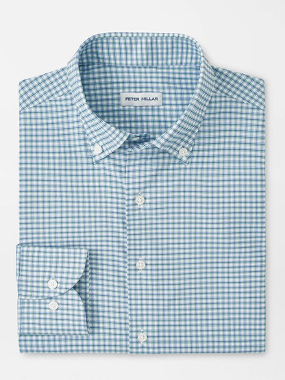 The Peter Millar Gregory Performance Twill Sport Shirt in Windsor Blue features a blue and white checkered pattern, long sleeves, button-down design, and UPF 50+ fabric for sun protection.