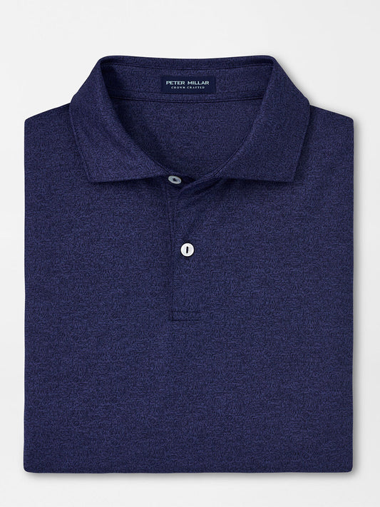 Peter Millar Instrumental Nouveau Performance Jersey Polo in Navy with UPF 50+ sun protection folded neatly on a flat surface.