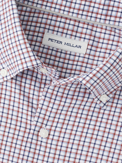 Close-up of the Peter Millar Julian Crown Lite Cotton-Stretch Shirt in Navy, showcasing a red, blue, and white checkered pattern, made from easy-care cotton-stretch fabric for effortless style.