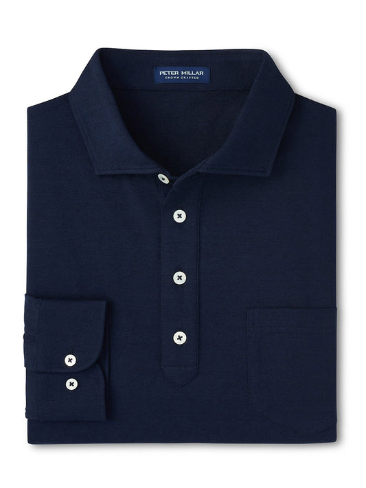 The Peter Millar Landon Long Sleeve Polo in Navy features a spread collar, white buttons, chest pocket, and visible label inside the collar. It's crafted from a cotton-linen blend for comfort and style.