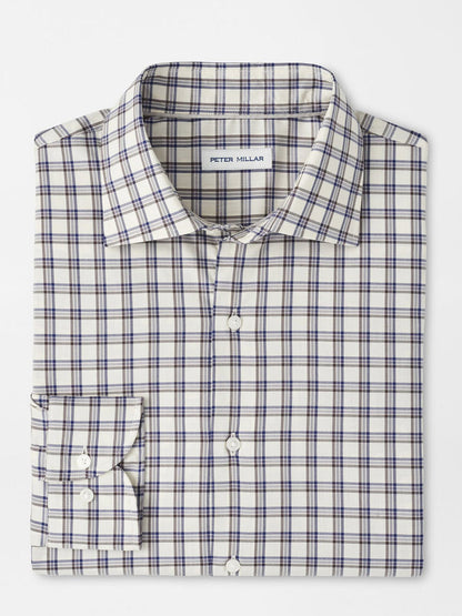 A Peter Millar Lenox Crown Lite Cotton-Stretch Sport Shirt in Winter Ivory with blue and brown plaid on white, neatly folded, long-sleeve, button-up style and a visible “Peter Millar” label inside the collar.