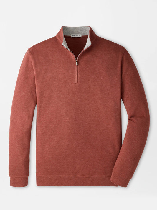 The Peter Millar Crown Comfort Pullover in Burnt Orange is a long-sleeve quarter-zip sweater featuring a stand collar and light gray inner lining, crafted from four-way stretch fabric for enhanced comfort, and is displayed on a plain white background.