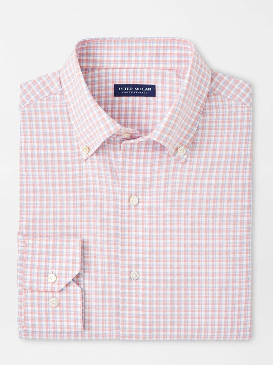 The Peter Millar Mingus Performance Poplin Sport Shirt in Pink Crepe has a pink and white checkered pattern, UPF 50+ sun protection, and a small label inside the collar.