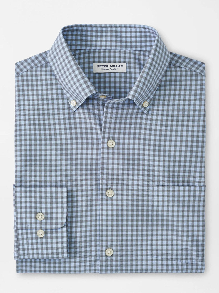 Product Description: The Peter Millar Murray Performance Poplin Sport Shirt in Navy features a navy and white checkered pattern, a front pocket, and white buttons. It is crafted from easy-care performance fabric and displayed against a plain white background.