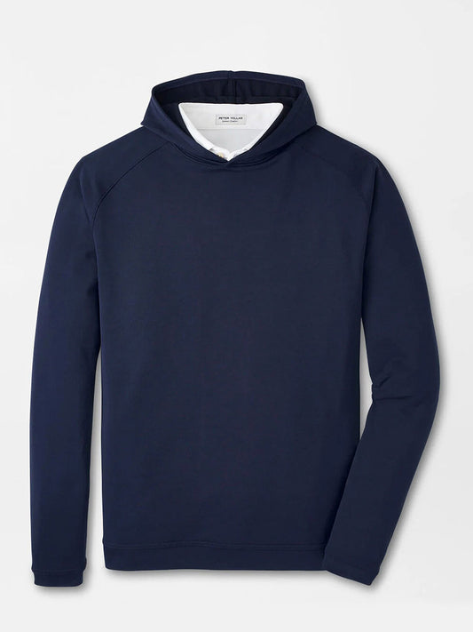 The Peter Millar Pine Performance Hoodie in Navy is a plain long-sleeve hoodie with a front pocket, crafted from breathable fabric and featuring no visible logos, shown laid flat on a light background.