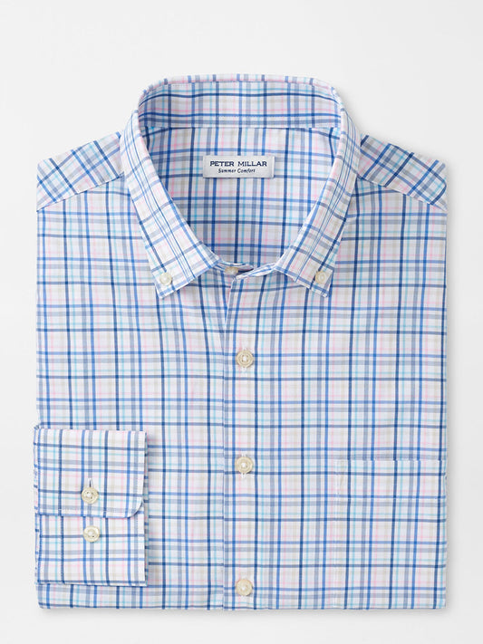 A folded sport shirt with a collar and a front pocket displaying the brand "Peter Millar," crafted from performance fabrication, the Peter Millar Roxbury Performance Poplin Sport Shirt in Maritime.