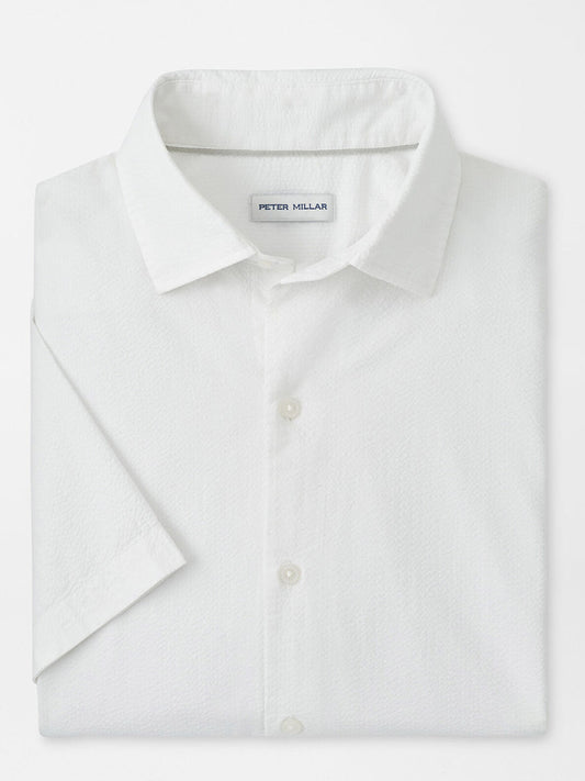 The Peter Millar Seaward Cotton Lyocell Sport Shirt in White is a neatly folded, short-sleeve, collared sport shirt with a "Peter Millar" label inside the neckline.