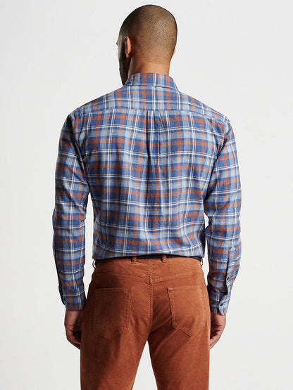 A person wearing a Peter Millar Sherbrooke Cotton Sport Shirt in Ocean Blue with brown pants, seen from the back.