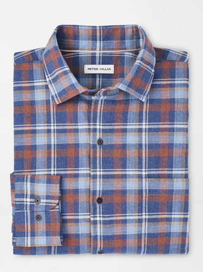 The Peter Millar Sherbrooke Cotton Sport Shirt in Ocean Blue is a folded plaid button-up made from cotton twill, incorporating blue, orange, and white colors with a classic fit, visible brand label on the collar, and providing breathable comfort.