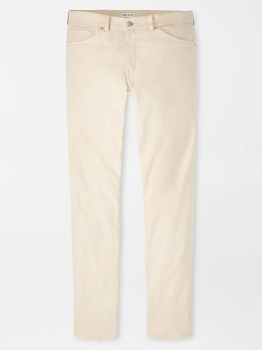 The Peter Millar Signature Sateen Five-Pocket Pant in Sand features a classic fit and two-way stretch fabric, with five pockets. Shown laid flat on a white background.