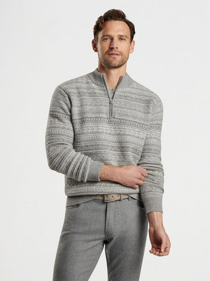 Man wearing a Gale Grey Peter Millar Silverton Jacquard Quarter-Zip and gray pants, standing against a plain background.