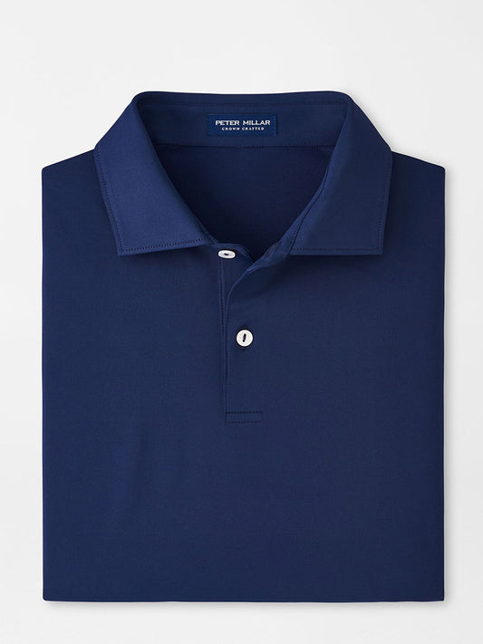 Peter Millar Solid Performance Jersey Polo in Navy displayed on a plain background with the collar neatly folded.