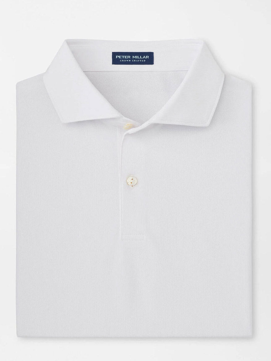 The Peter Millar Soul Performance Mesh Polo in White is a collared, two-button shirt made from wicking mesh fabric for breathable comfort, with the "Peter Millar" label inside the collar.