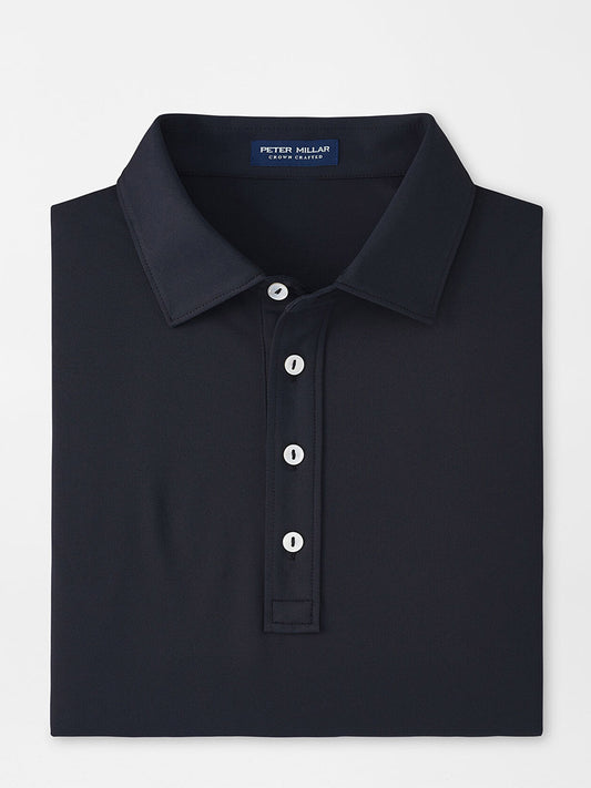 Peter Millar Soul Performance Mesh Polo in Black with white buttons displayed on a light background.