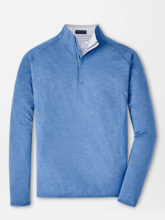 Peter Millar Stealth Performance Quarter-Zip in Cascade Blue with UPF 50+ sun protection, displayed on a white background.