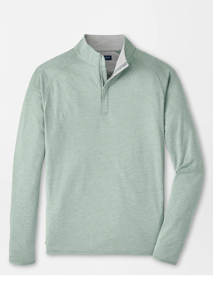 The Peter Millar Stealth Performance Quarter-Zip in Willow is a light green, lightweight pullover with a short stand collar, moisture-wicking fabric, and UPF 50+ protection, shown on a plain white background.