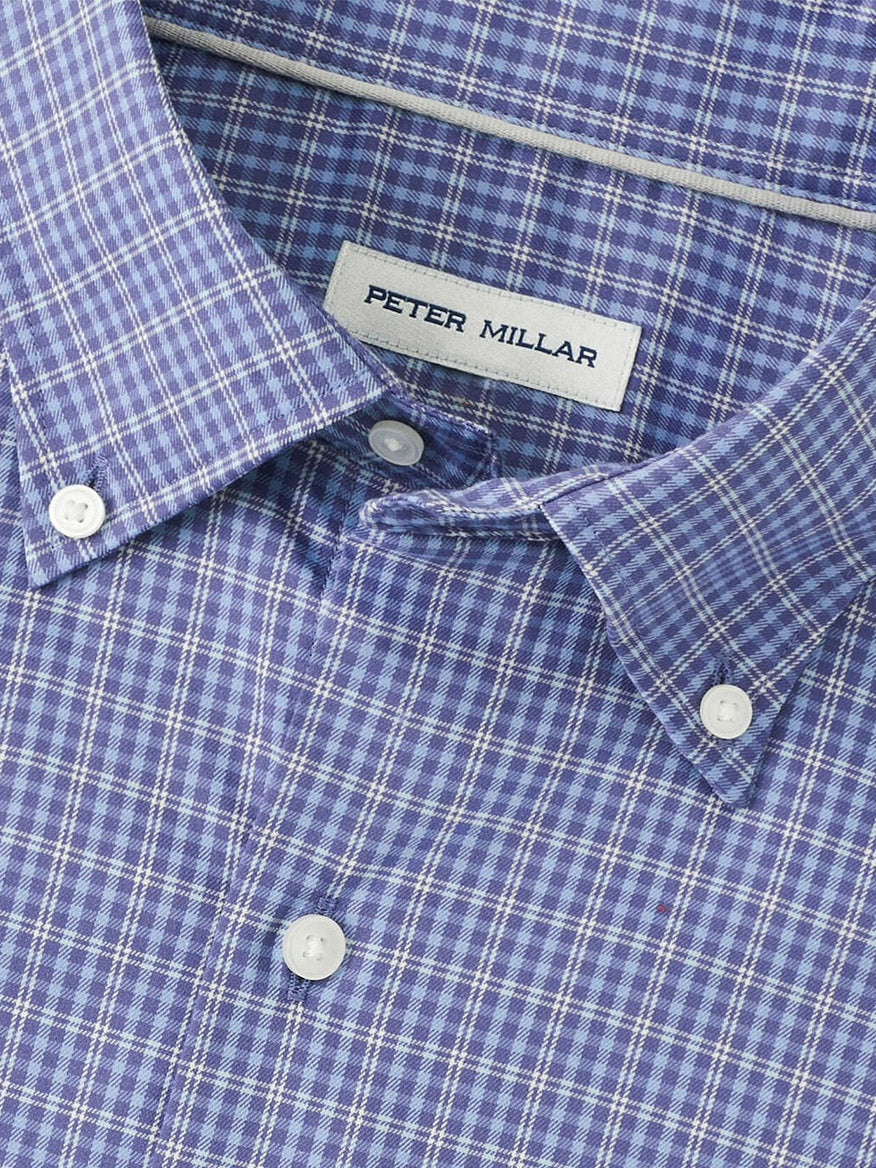 Close-up of the Peter Millar Stowe Crown Lite Cotton-Stretch Sport Shirt in Deep Violet, with a visible brand label inside the collar. This classic-fit, checkered shirt blends timeless style with comfort.
