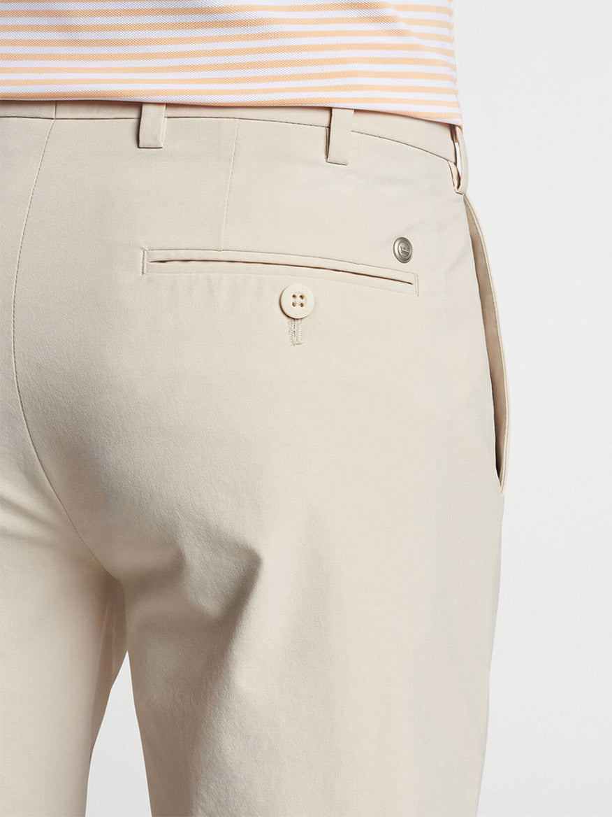 Close-up of the back pocket and waistband of Peter Millar Surge Performance Short in British Cream.