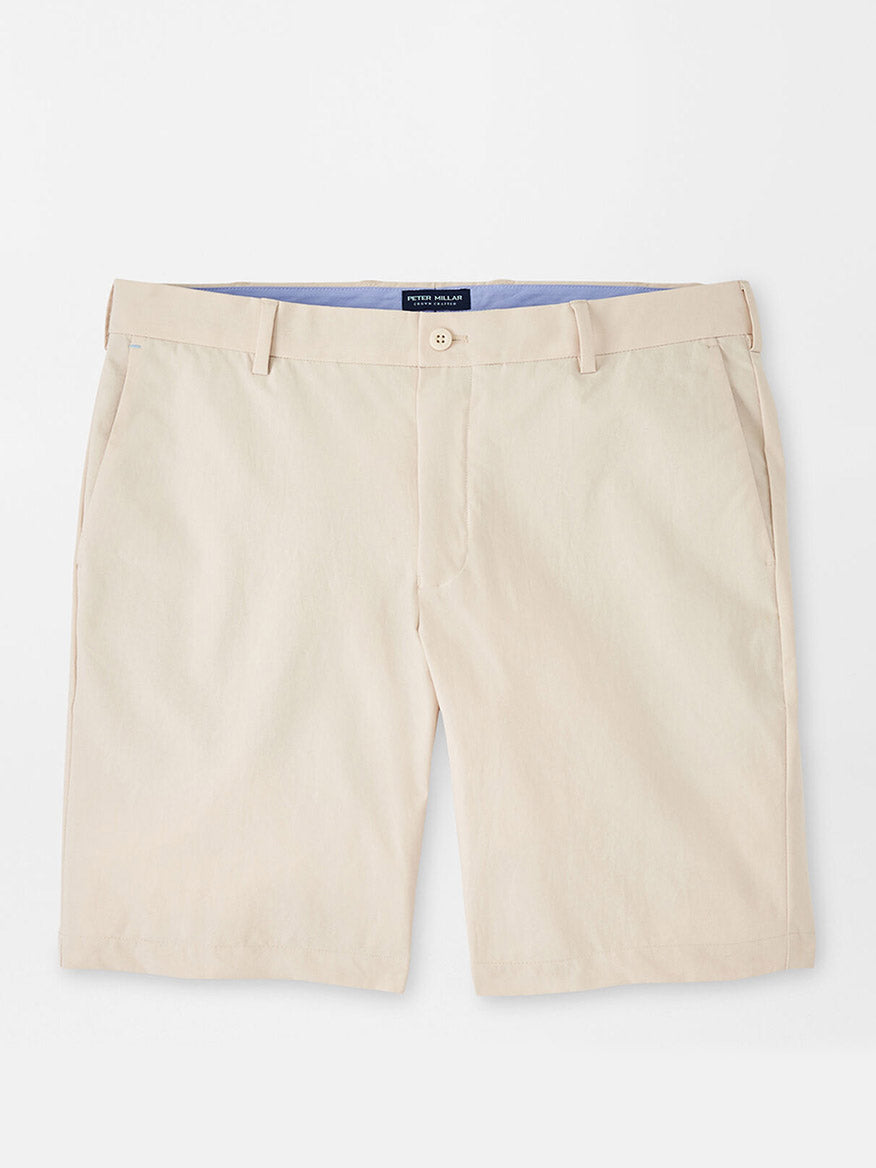 Peter Millar Surge Performance Short in British Cream with water-resistant protection displayed on a neutral background.