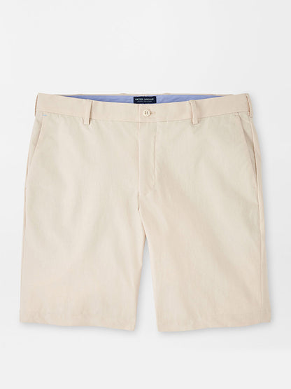Peter Millar Surge Performance Short in British Cream with water-resistant protection displayed on a neutral background.
