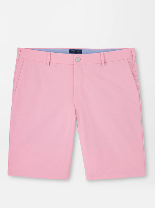 Pink men's Peter Millar Surge Performance Shorts in Spring Blossom with water-resistant protection on a plain background.