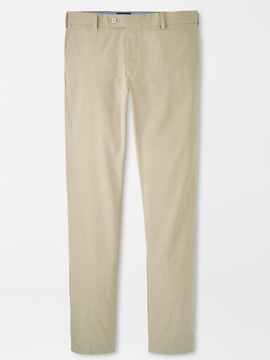 A pair of Peter Millar Surge Performance Trouser in Toffee with belt loops, a button closure, and side pockets, featuring four-way stretch fabric for enhanced comfort, laid out flat on a white background.