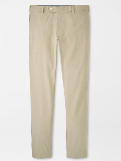 A pair of Peter Millar Surge Performance Trouser in Toffee with belt loops, a button closure, and side pockets, featuring four-way stretch fabric for enhanced comfort, laid out flat on a white background.