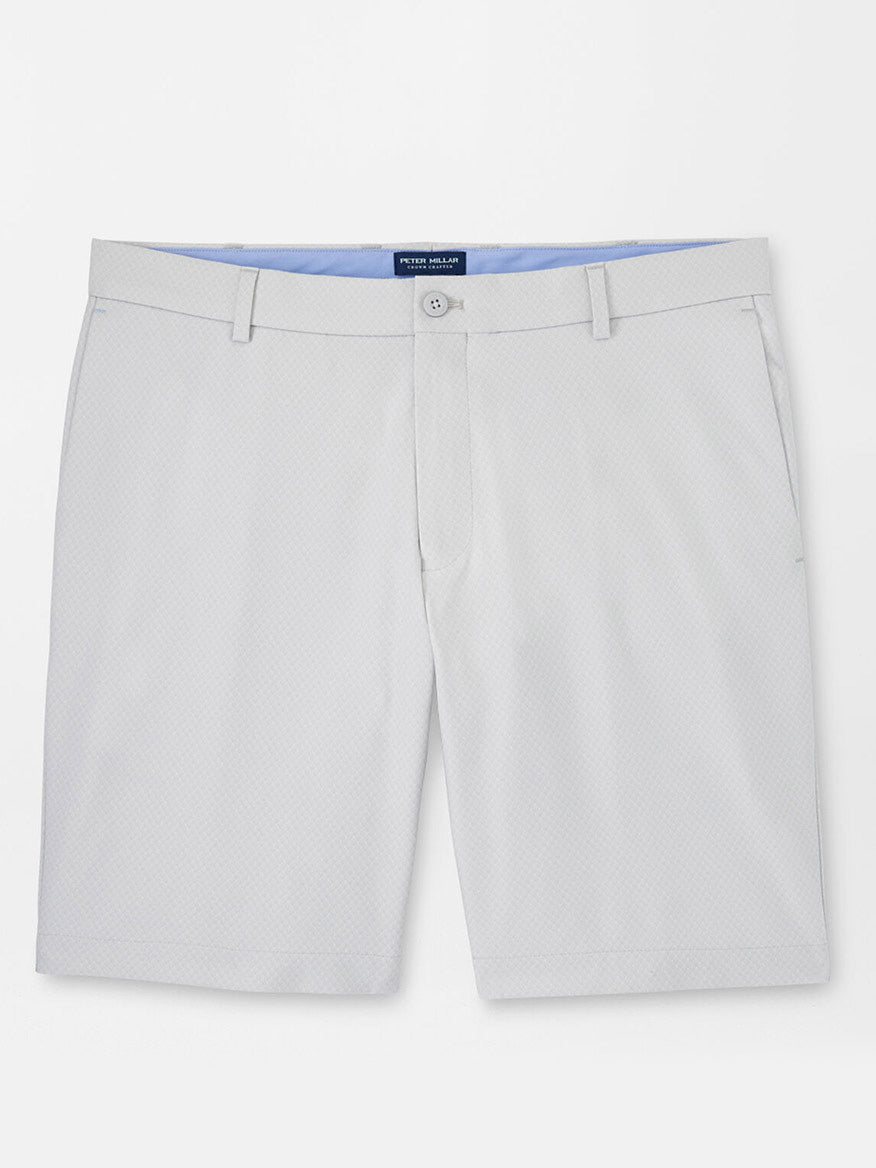 A pair of Peter Millar Surge Signature Performance Shorts in British Grey featuring water-resistant protection, displayed against a white background.