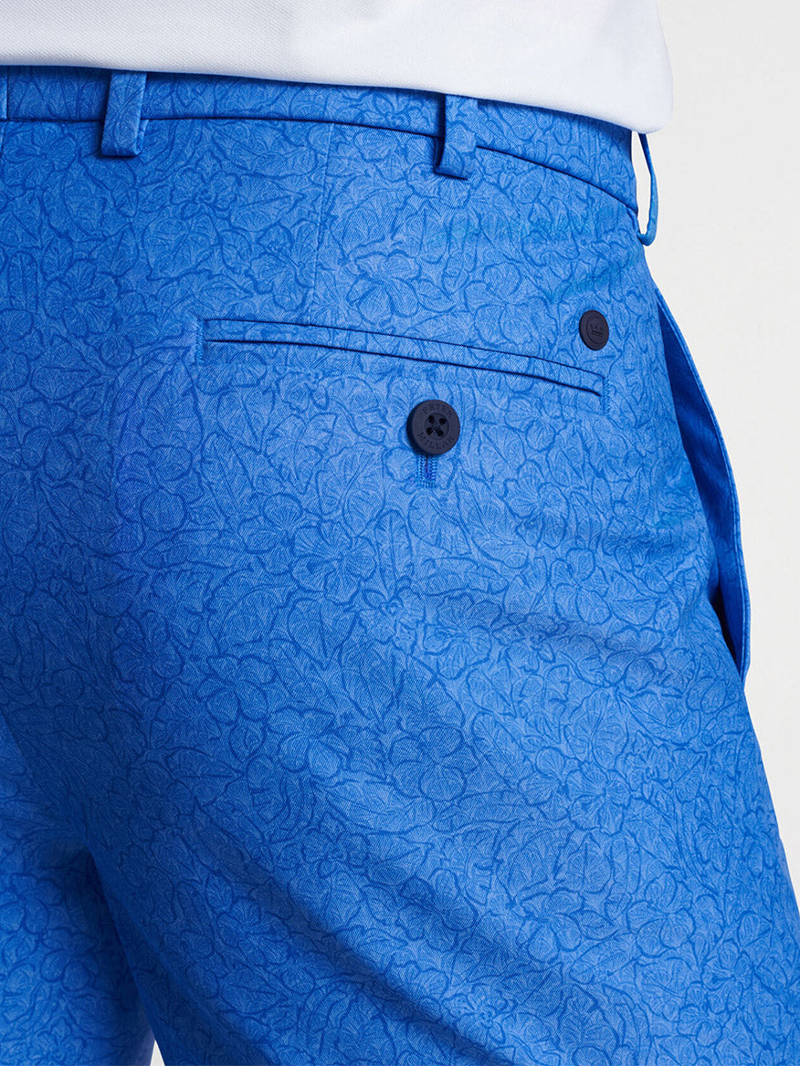 Close-up of a Peter Millar Surge Trellis Performance Short in Regatta Blue with four-way stretch, pockets, and a drawstring waistband.