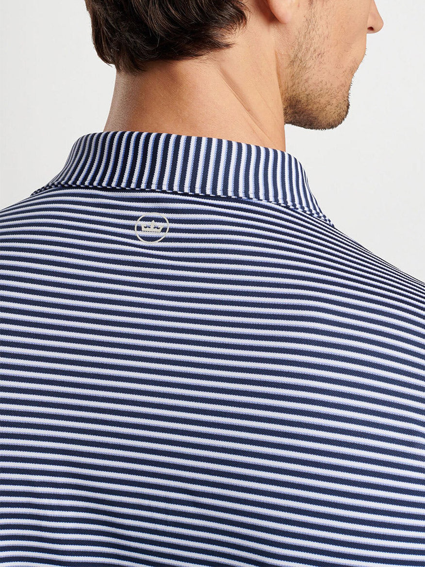 Close-up of the back of the Peter Millar Tempo Performance Mesh Polo in Navy, featuring vintage-inspired collars and a small logo near the neckline.