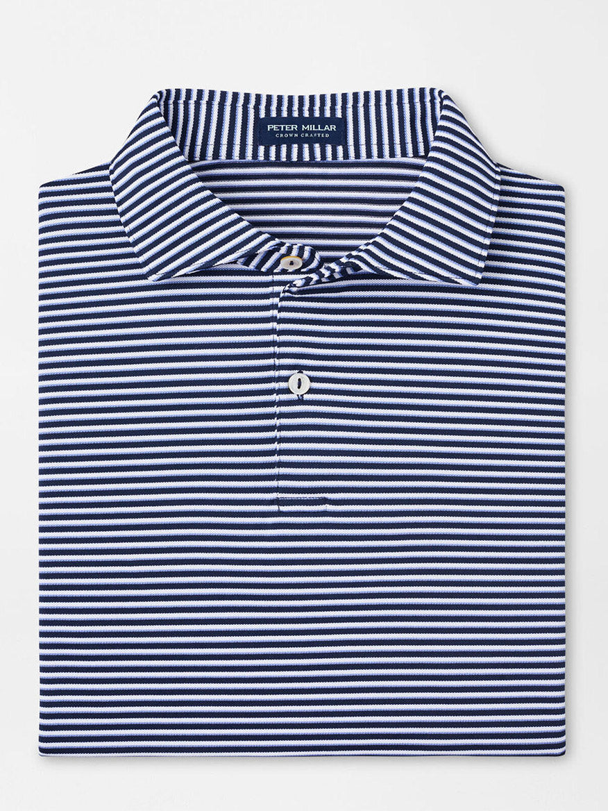 The Peter Millar Tempo Performance Mesh Polo in Navy features a vintage-inspired collar, button placket, and offers four-way stretch for comfort in a folded navy blue and white striped design.