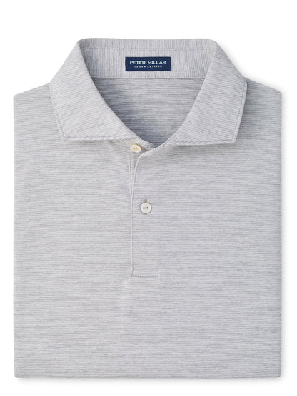 A neatly folded Peter Millar Treble Performance Jersey Polo Edwin Spread Collar in Gale Grey, featuring two buttons and four-way stretch for ultimate comfort.