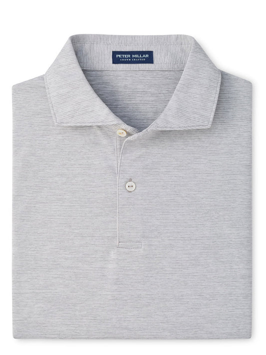 A neatly folded Peter Millar Treble Performance Jersey Polo Edwin Spread Collar in Gale Grey, featuring two buttons and four-way stretch for ultimate comfort.