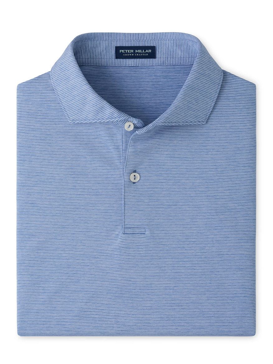 The Peter Millar Treble Performance Jersey Polo Edwin Spread Collar in Windy Blue is a light blue striped polo with a spread collar, two buttons, and four-way stretch, featuring the Peter Millar label inside the neck.
