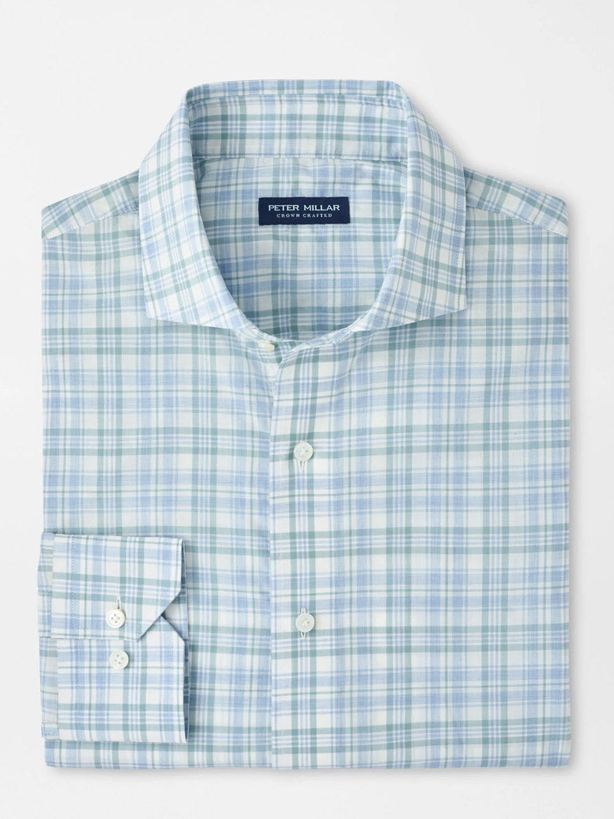 The Peter Millar Tropea Italian Poplin Sport Shirt in Light Willow is a neatly folded, long-sleeve plaid shirt in light blue, green, and white. Made from Italian cotton, it features a tailored fit, collar, and the signature Peter Millar label inside.