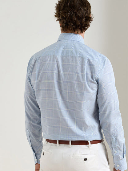 A man is shown from the back wearing the Peter Millar Urbino Italian Poplin Sport Shirt in Iris Mist with white pants.