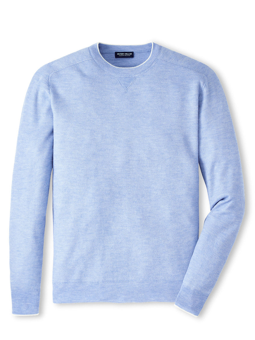A Peter Millar Voyager Cashmere-Silk Saddle Shoulder Crew in Tahoe Blue sweater.