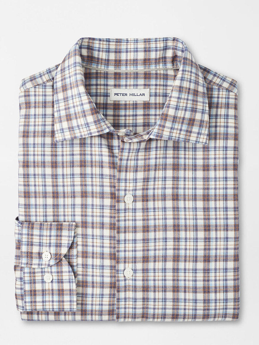 The Peter Millar Waynesville Performance Flannel Sport Shirt in Winter Ivory features a blue, brown, and white plaid, crafted from performance fibers with a front pocket—perfect as your go-to fall shirt.