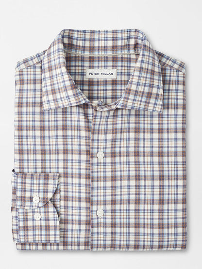 The Peter Millar Waynesville Performance Flannel Sport Shirt in Winter Ivory features a blue, brown, and white plaid, crafted from performance fibers with a front pocket—perfect as your go-to fall shirt.