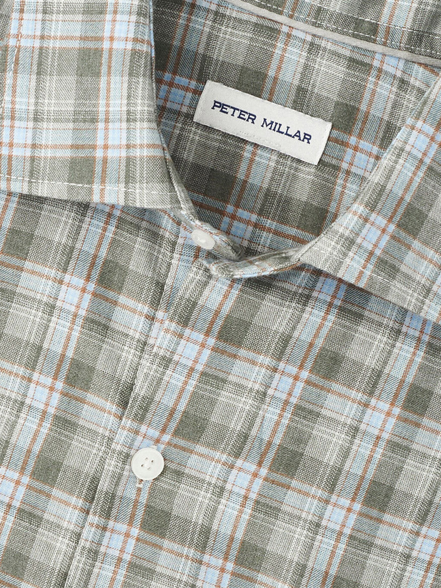 Close-up of the Peter Millar Whitecap Performance Flannel Sport Shirt in Basil, featuring a classic fit and plaid pattern in green, blue, and brown tones, crafted from soft performance fibers for comfort and style.