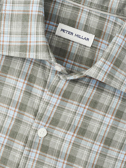 Close-up of the Peter Millar Whitecap Performance Flannel Sport Shirt in Basil, featuring a classic fit and plaid pattern in green, blue, and brown tones, crafted from soft performance fibers for comfort and style.