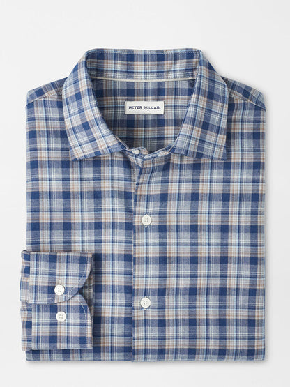 The Peter Millar Whitecap Performance Flannel Sport Shirt in Blue Haze features blue, white, and beige plaid, a visible label, and a comfortable fit—your ideal button-up for fall, displayed on a plain white background.