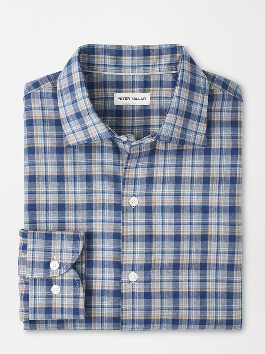 The Peter Millar Whitecap Performance Flannel Sport Shirt in Blue Haze features blue, white, and beige plaid, a visible label, and a comfortable fit—your ideal button-up for fall, displayed on a plain white background.