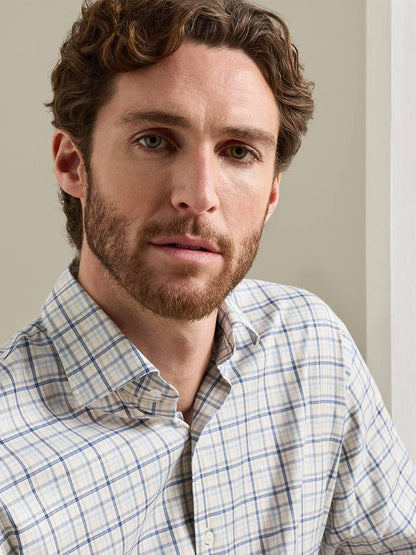 A man with short brown hair and a beard wears the Peter Millar Wyatt Crown Soft Twill Sport Shirt in Multi, looking directly at the camera against a plain indoor background.