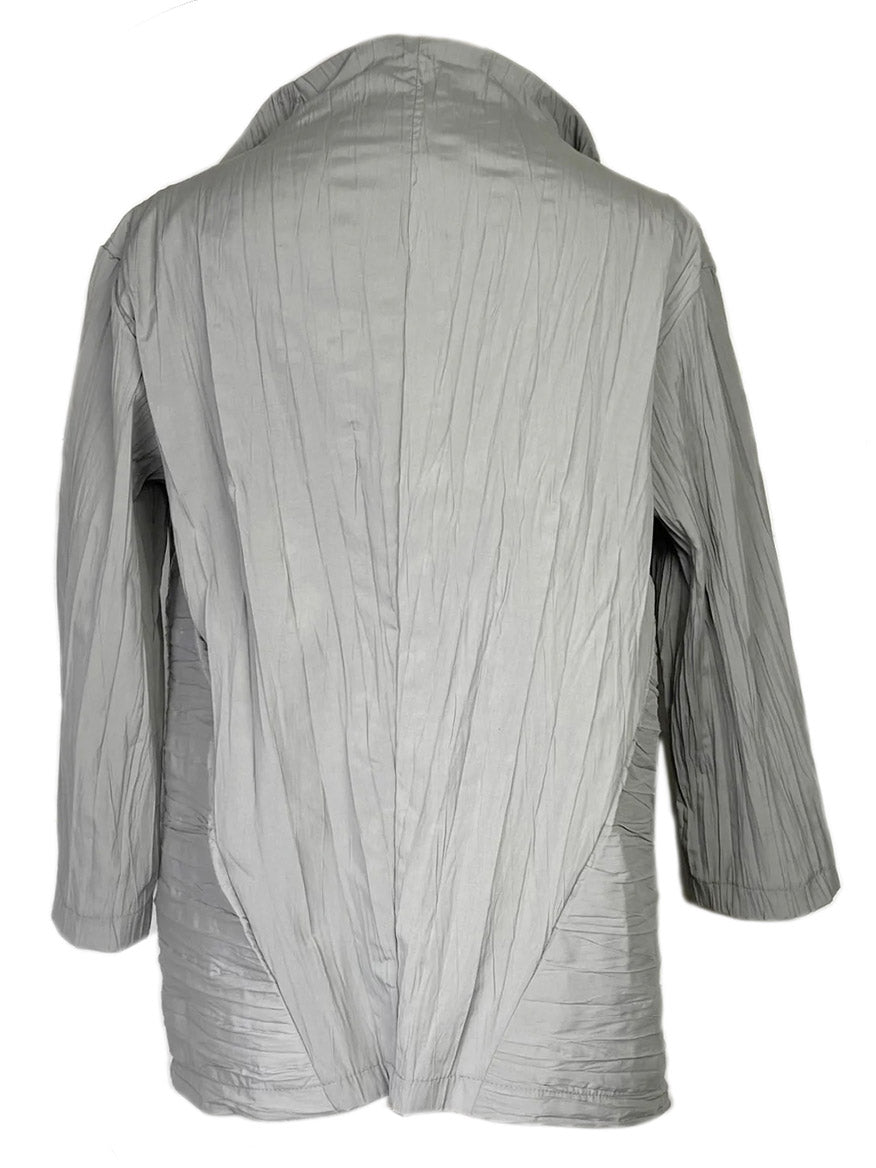 A Porto Cicero Pleated Jacket in Dove displayed from the back, crafted from luxurious Japanese textile.