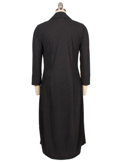 The Porto Flavia Dress in Smoke Reggio, displayed from the back on a dress form, features a split lapel collar and three-quarter sleeves. Made in Italy.
