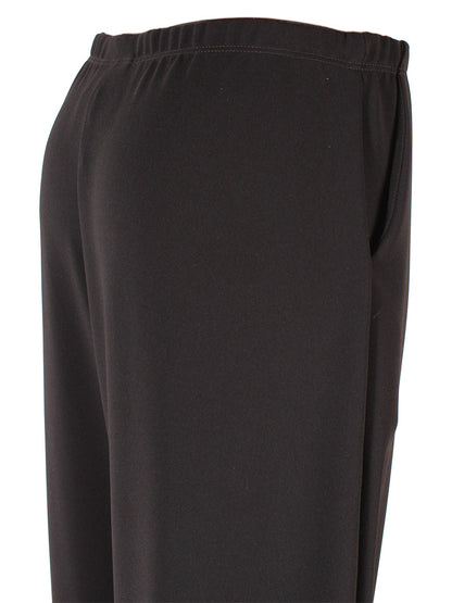 Close-up of Porto Holiday Crepe Pant in Black fabric with an elastic waistband.