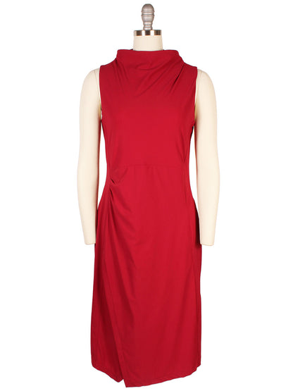 The Porto Nina Dress in Garnet, crafted in Italy, features a draped neckline and subtle side ruching on a knee-length silhouette, elegantly shown on a mannequin.