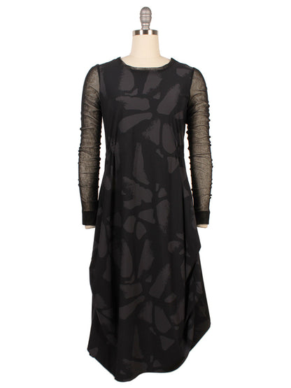 The Porto Venetian Dress in Smoke Palermo, made in Italy, features black mesh long sleeves and an abstract dark pattern, elegantly displayed on a mannequin.